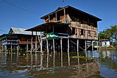 Inle Lake Myanmar. All the buildings are constructed on piles. Residents travel around by canoe, but there are also bamboo walkways and bridges over the canals, monasteries and stupas. 